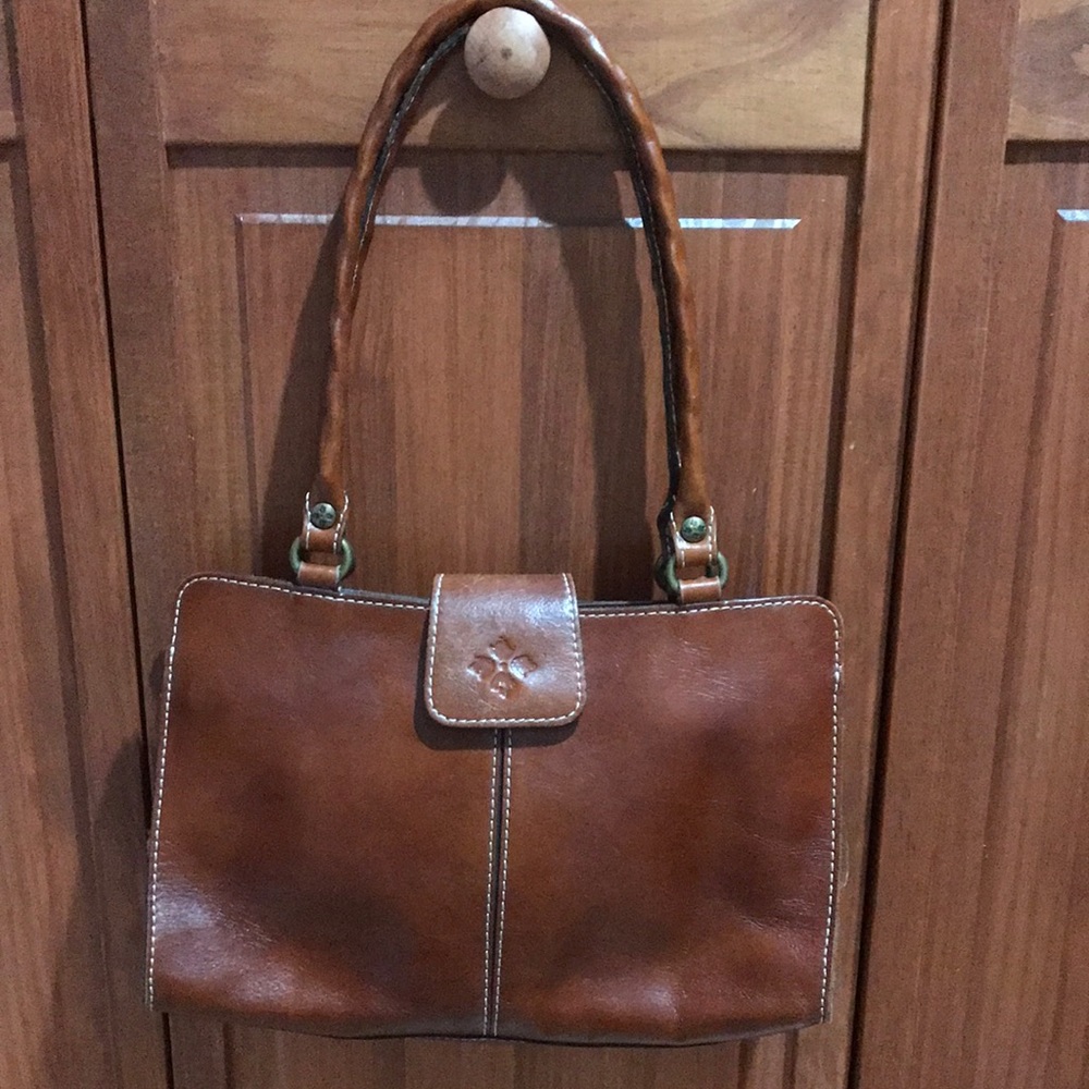 Patricia Nash handbag. Slight wear on the front closure flap.